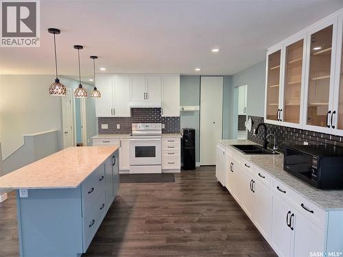 621 Mccall Street, Oxbow, SK - Indoor Photo Showing Kitchen With Double Sink