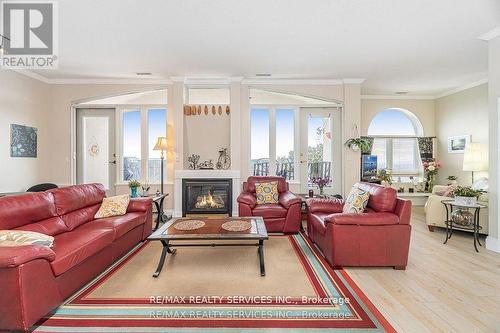 Ph03 - 7 Dayspring Circle, Brampton, ON - Indoor Photo Showing Living Room With Fireplace