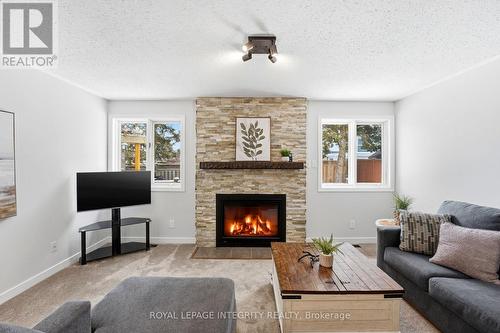 4 Adele Crescent, Ottawa, ON - Indoor Photo Showing Living Room With Fireplace