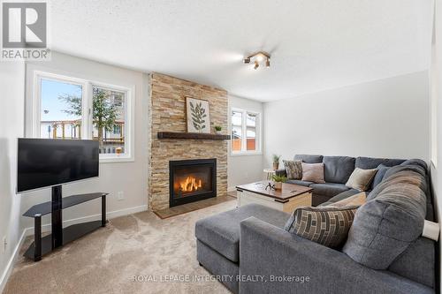 4 Adele Crescent, Ottawa, ON - Indoor Photo Showing Living Room With Fireplace