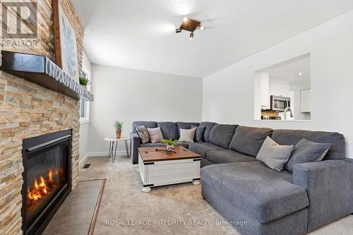 4 Adele Crescent, Ottawa, ON - Indoor Photo Showing Living Room With Fireplace