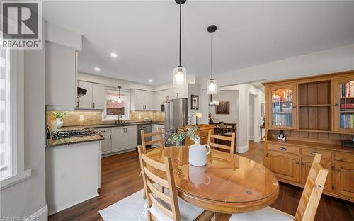 Dining room featuring dark wood finished floors and recessed lighting - 4516 Gullfoot Circle, Mississauga, ON - Indoor