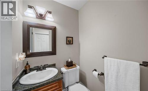 Half bathroom featuring vanity and toilet - 4516 Gullfoot Circle, Mississauga, ON - Indoor Photo Showing Bathroom