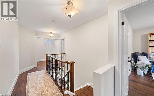 Hallway with an upstairs landing and dark wood-type flooring - 4516 Gullfoot Circle, Mississauga, ON - Indoor Photo Showing Other Room