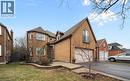 View of front facade featuring brick siding, a garage, driveway, and a front yard - 4516 Gullfoot Circle, Mississauga, ON  - Outdoor 