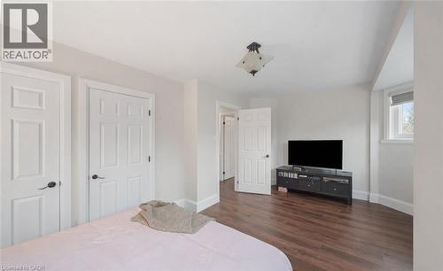 Bedroom with dark wood-style floors and baseboards - 4516 Gullfoot Circle, Mississauga, ON - Indoor Photo Showing Bedroom