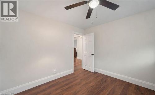 Empty room with dark wood finished floors and a ceiling fan - 4516 Gullfoot Circle, Mississauga, ON - Indoor Photo Showing Other Room