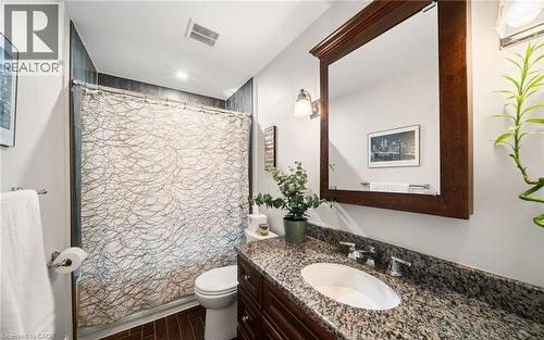 Bathroom featuring vanity and dark wood finished floors - 4516 Gullfoot Circle, Mississauga, ON - Indoor Photo Showing Bathroom