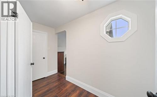 Corridor with dark wood-style flooring and baseboards - 4516 Gullfoot Circle, Mississauga, ON - Indoor Photo Showing Other Room