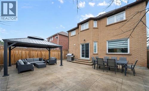 Fenced backyard featuring entry steps, outdoor lounge area, a patio area, a gazebo, and a grill - 4516 Gullfoot Circle, Mississauga, ON - Outdoor With Deck Patio Veranda With Exterior
