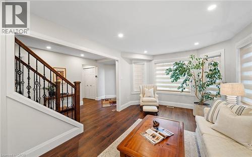 Living area featuring dark wood-style flooring and recessed lighting - 4516 Gullfoot Circle, Mississauga, ON - Indoor