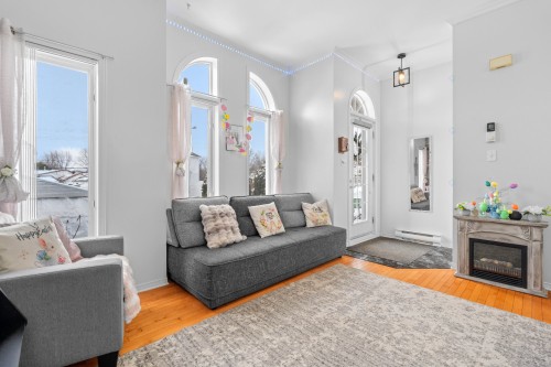 Salle familiale - 851 Rue Primeau, Saint-Eustache, QC - Indoor Photo Showing Living Room With Fireplace