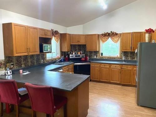 95 Crestview Drive, Onanole, MB - Indoor Photo Showing Kitchen With Double Sink
