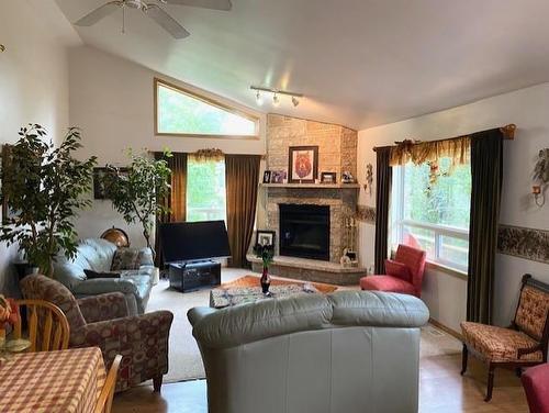 95 Crestview Drive, Onanole, MB - Indoor Photo Showing Living Room With Fireplace