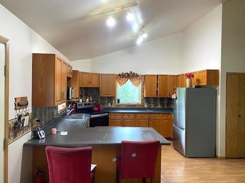 95 Crestview Drive, Onanole, MB - Indoor Photo Showing Kitchen With Double Sink