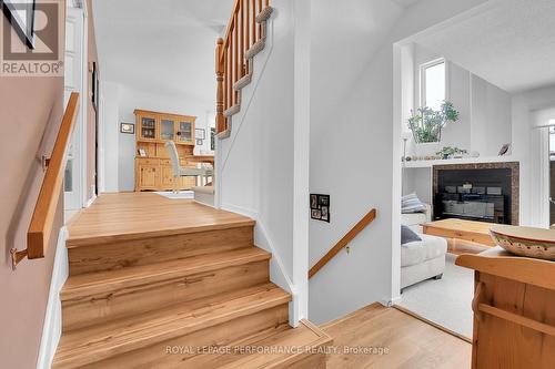Family Rm on right, up to main living areas - 43 Waterview Court, Ottawa, ON - Indoor Photo Showing Other Room With Fireplace