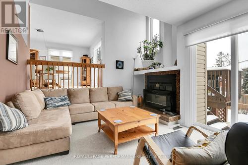 Family Rm w/fireplace & patio doors to back yard - 43 Waterview Court, Ottawa, ON - Indoor Photo Showing Living Room With Fireplace