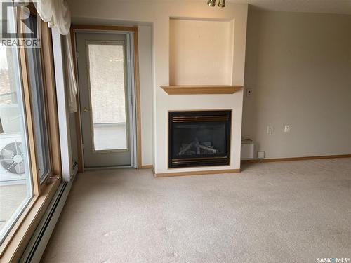 329 325 Keevil Crescent, Saskatoon, SK - Indoor Photo Showing Living Room With Fireplace