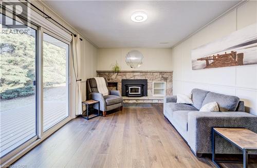 Cozy family room with wood fireplace insert. - 63 Kingston Crescent, Kitchener, ON - Indoor Photo Showing Living Room With Fireplace