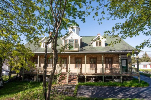 Front of Structure - 309 Rue Taché, Saint-Pascal, QC - Outdoor With Deck Patio Veranda