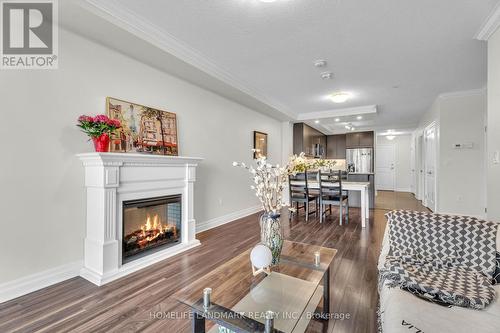 313 - 260 Villagewalk Boulevard, London North, ON - Indoor Photo Showing Living Room With Fireplace