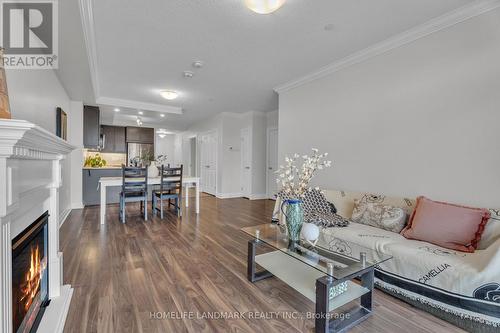 313 - 260 Villagewalk Boulevard, London North, ON - Indoor Photo Showing Living Room With Fireplace