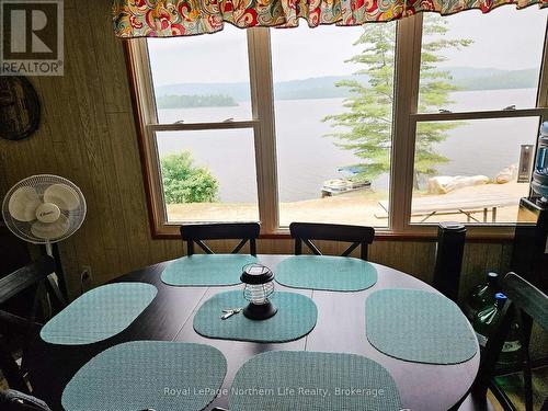 1055E Argo Run, Mattawan, ON - Indoor Photo Showing Dining Room With Body Of Water