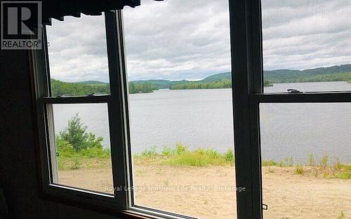 1055E Argo Run, Mattawan, ON -  Photo Showing Other Room With Body Of Water