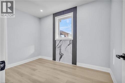 Empty room with light wood-type flooring and recessed lighting - 84 Avalon Place, Kitchener, ON - Indoor Photo Showing Other Room