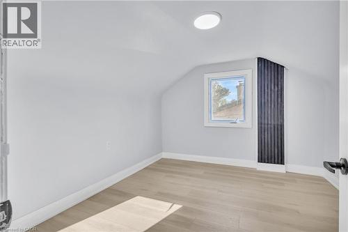 Bonus room with light wood-type flooring and vaulted ceiling - 84 Avalon Place, Kitchener, ON - Indoor Photo Showing Other Room