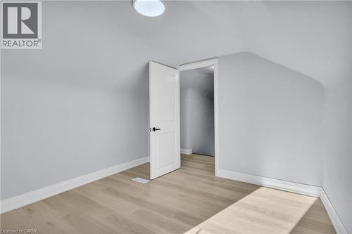 Bonus room featuring light wood-style floors and vaulted ceiling - 84 Avalon Place, Kitchener, ON - Indoor Photo Showing Other Room
