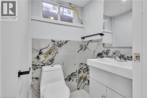 Half bathroom featuring vanity and toilet - 84 Avalon Place, Kitchener, ON - Indoor