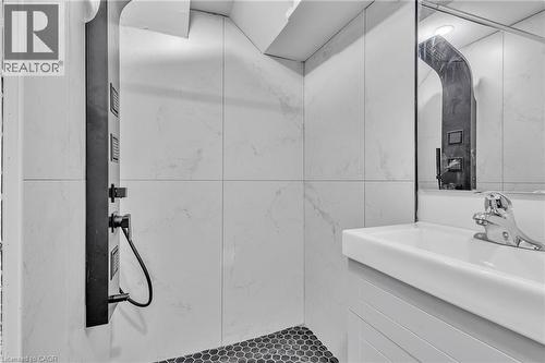 Full bathroom featuring vanity, a marble finish shower, and tile walls - 84 Avalon Place, Kitchener, ON - Indoor Photo Showing Bathroom
