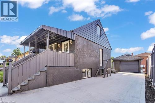 View of property exterior with an outbuilding and a garage - 84 Avalon Place, Kitchener, ON - Outdoor With Exterior