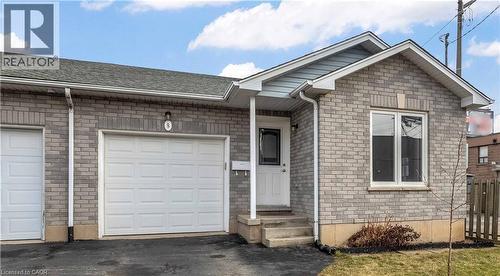 Ranch-style house featuring brick siding, a garage, and asphalt driveway - 8 Brantdale Avenue, Hamilton, ON - Outdoor