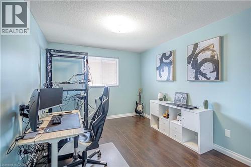Office area featuring dark wood-style flooring and a textured ceiling - 8 Brantdale Avenue, Hamilton, ON - Indoor Photo Showing Office
