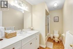 Full bath featuring vanity and enclosed tub / shower combo - 
