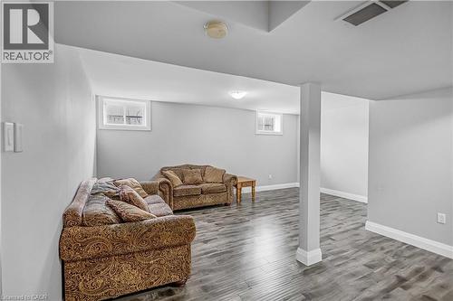 Living room with baseboards and wood finished floors - 8 Brantdale Avenue, Hamilton, ON - Indoor
