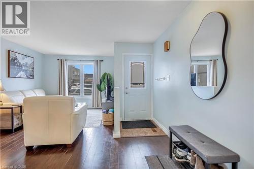 Living area featuring dark wood-type flooring and baseboards - 8 Brantdale Avenue, Hamilton, ON - Indoor Photo Showing Other Room
