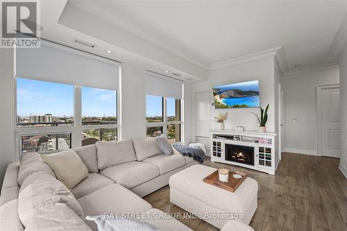 902 - 7730 Kipling Avenue, Vaughan, ON - Indoor Photo Showing Living Room With Fireplace