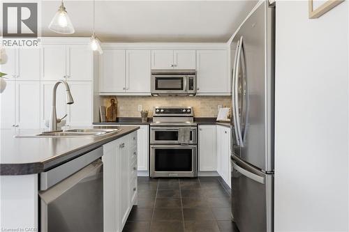 910 Vickerman Way, Milton, ON - Indoor Photo Showing Kitchen With Double Sink With Upgraded Kitchen