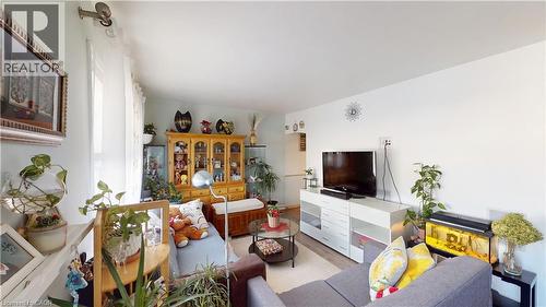 Living room with light wood-style floors - 10 Armstrong Avenue, Hamilton, ON - Indoor