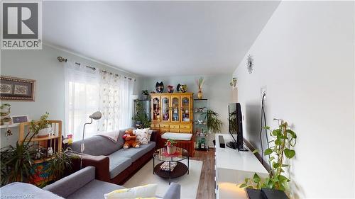 Living room with wood finished floors - 10 Armstrong Avenue, Hamilton, ON - Indoor Photo Showing Living Room