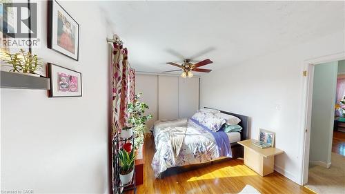Bedroom with light wood-style flooring and ceiling fan - 10 Armstrong Avenue, Hamilton, ON - Indoor Photo Showing Bedroom