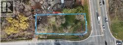 Aerial view of property and surrounding area with property boundaries highlighted - 