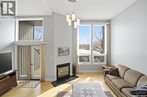 14 455 Pinehouse Drive, Saskatoon, SK - Indoor Photo Showing Living Room With Fireplace