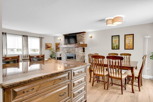 Cuisine - 345 Rue Des Rochers, Sainte-Adèle, QC - Indoor Photo Showing Dining Room With Fireplace