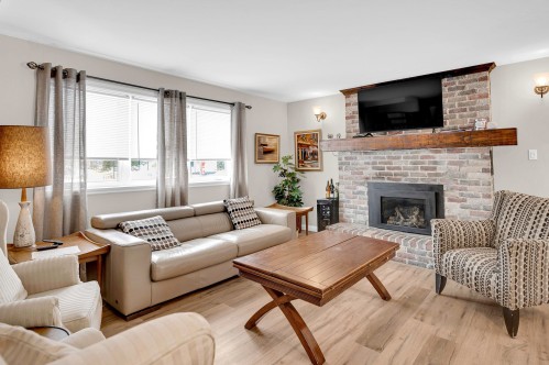 Salon - 345 Rue Des Rochers, Sainte-Adèle, QC - Indoor Photo Showing Living Room With Fireplace