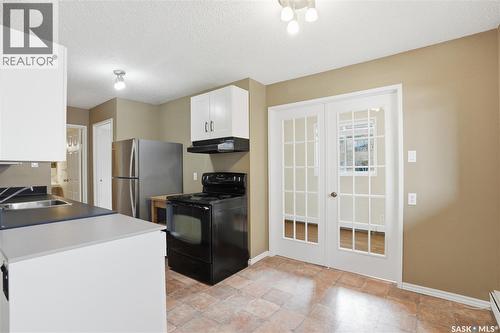208B 4040 8Th Street E, Saskatoon, SK - Indoor Photo Showing Kitchen With Double Sink