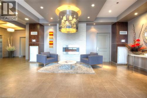 Common area featuring recessed lighting, wooden walls, and a raised ceiling - 191 King Street S Unit# 712, Waterloo, ON - Indoor